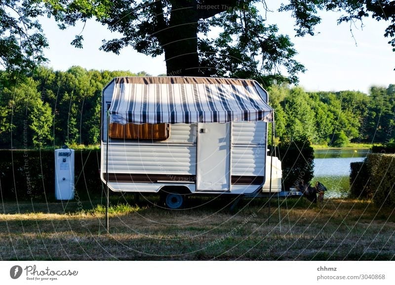 Living by the lake Caravan Camping Vacation & Travel Deserted Camping site rural Lake Colour photo Leisure and hobbies Summer Nature Freedom Shadow Idyll