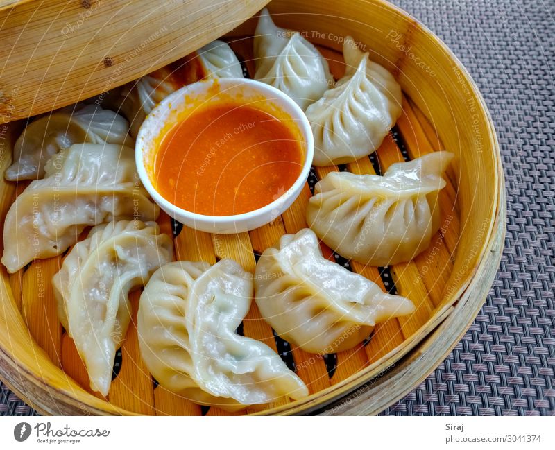 Momo or Dumplings Food Meat Vegetable Nutrition Eating Lunch Business lunch Asian Food Pan Healthy Eating Feasts & Celebrations Wooden spoon Feeding Flour