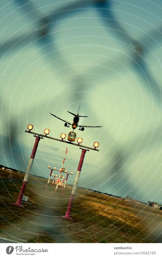 Approach TXL Landing Airplane landing Berlin Motion blur Carbon dioxide Flying Aviation Floating Airport Airfield Worm's-eye view Sky Heaven Deserted