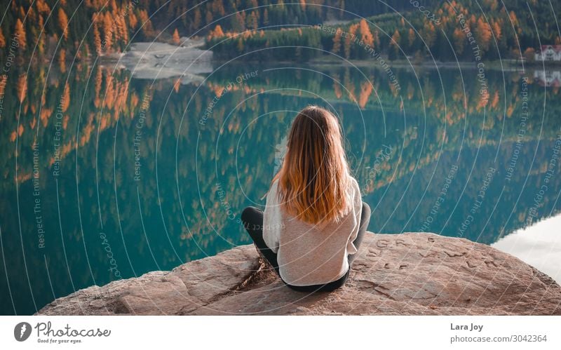 Girl sitting on rock by a mountain lake Design Vacation & Travel Tourism Trip Adventure Freedom Expedition Mountain Hiking Human being Young woman
