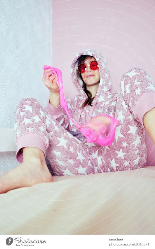 crazy teenager Youth (Young adults) Young woman youthful Infancy Goofy Crazy Daft Joy Brash Pink Star (Symbol) Bed Cozy Playing Sunglasses Pyjama Grinning slime