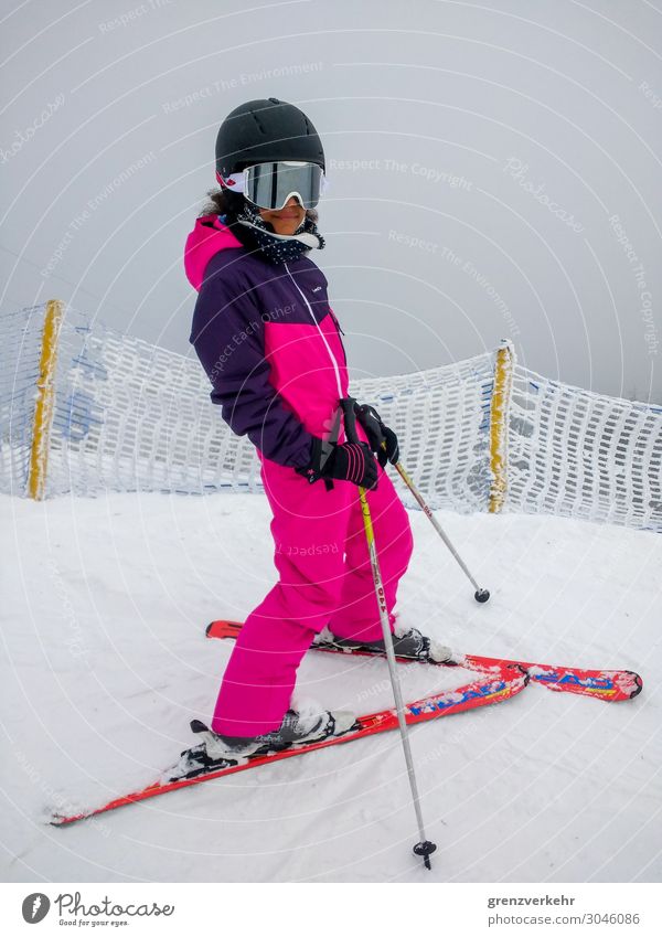 shut down Snow Winter vacation Skiing Ski suit Skis Ski pole Skiing helmet Skier Downhill race Ski run Human being Feminine Girl 1 8 - 13 years Child Infancy