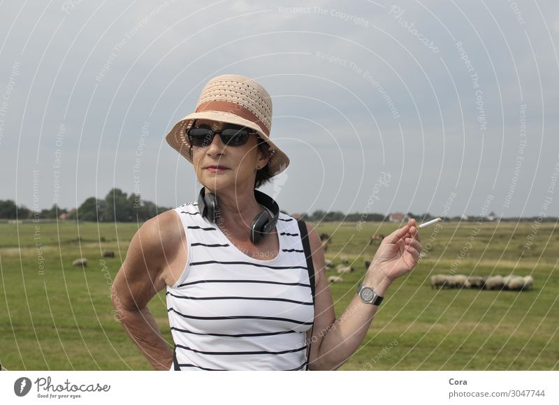 Woman at the dike Lifestyle Elegant Human being Feminine Adults 1 45 - 60 years Relaxation Colour photo Exterior shot Close-up Day Portrait photograph
