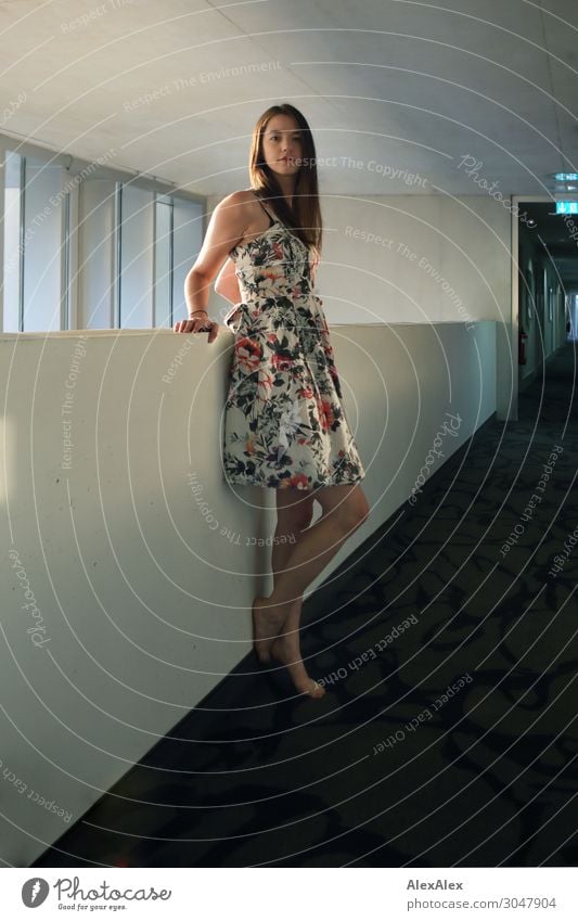 Young woman in hotel corridor Lifestyle Style Joy Beautiful Well-being Hallway Hotel Window Corridor Youth (Young adults) 18 - 30 years Adults Dress Barefoot
