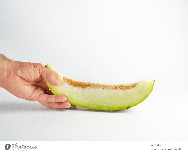 male hand holds a piece of ripe melon with seeds Vegetable Fruit Dessert Nutrition Vegetarian diet Diet Summer Hand Nature Plant Eating Fresh Natural Juicy
