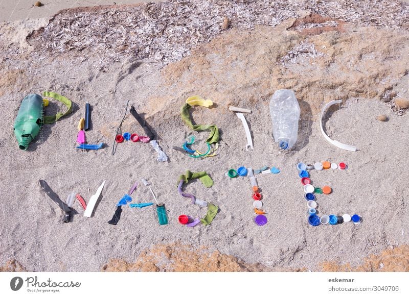 plastic waste Beach Ocean Environment Nature Sand Water Coast Mediterranean sea Plastic packaging Authentic Dirty Multicoloured Plastic waste Trash Word writing