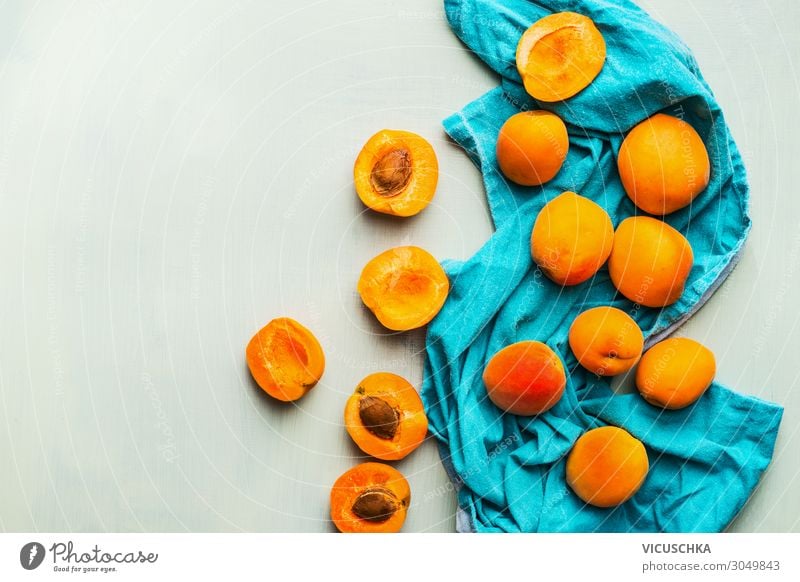 Fresh ripe apricots on blue kitchen towel Food Fruit Nutrition Style Design Healthy Eating Hip & trendy Yellow Background picture Dish towel Apricot Scattered