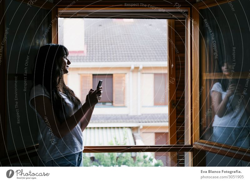 young caucasian woman by the window using mobile phone Lifestyle Happy Relaxation Leisure and hobbies Playing Reading Vacation & Travel