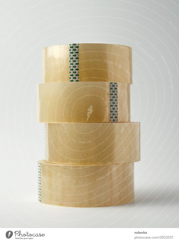stack of transparent adhesive tape Office Tool Packaging Package Plastic Yellow White Adhesive background Bobbin circle clear Delivery equipment glue Material