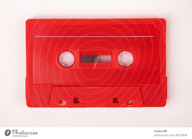 Red music cassette Lifestyle Music Plastic Retro Nostalgia Tape cassette audio Vintage 80s bare analogue dance isolated eighties Disco Background picture label