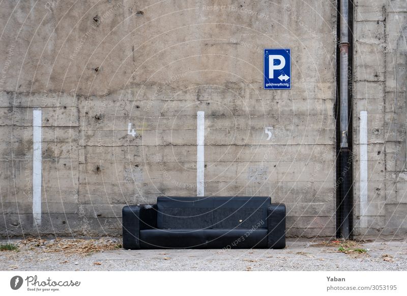 Parked Closing time Living or residing Old Town Gray Black Decline Sofa Bulk rubbish Squander Parking lot Concrete wall Colour photo Exterior shot