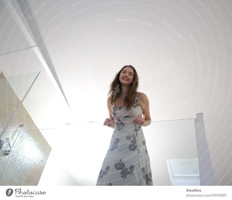 Young woman leans against a glass railing and smiles Lifestyle Style Joy Beautiful Flat (apartment) Bathroom Loft Skylight Handrail Pane Shower (Installation)