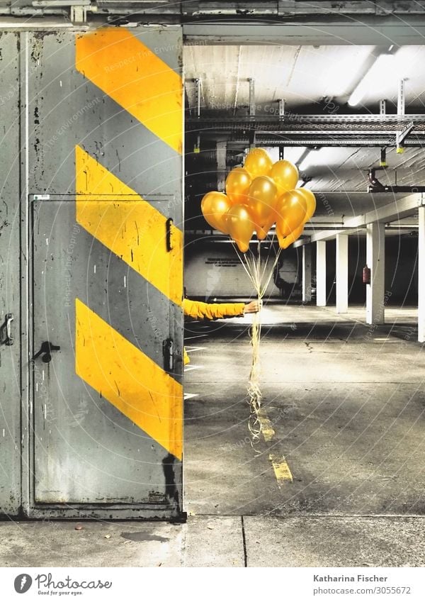 Yellow Balloons for you Parking garage Wall (barrier) Wall (building) Stone Concrete Signs and labeling Graffiti Line Stripe Illuminate Gray Orange Black White