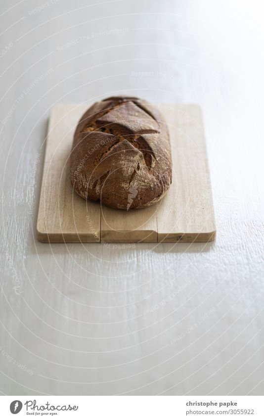Loaf of bread on wooden board Food Bread Fresh Healthy Wooden board Part Baking Bakery uncut Colour photo Interior shot Close-up Deserted Copy Space top