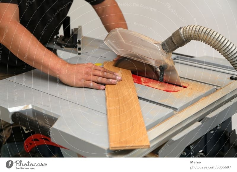 The worker cuts the parquet on a circular saw Wooden board Joiner Construction site Industry Industrial Photography Parquet floor Saw Working man Jigsaw Table
