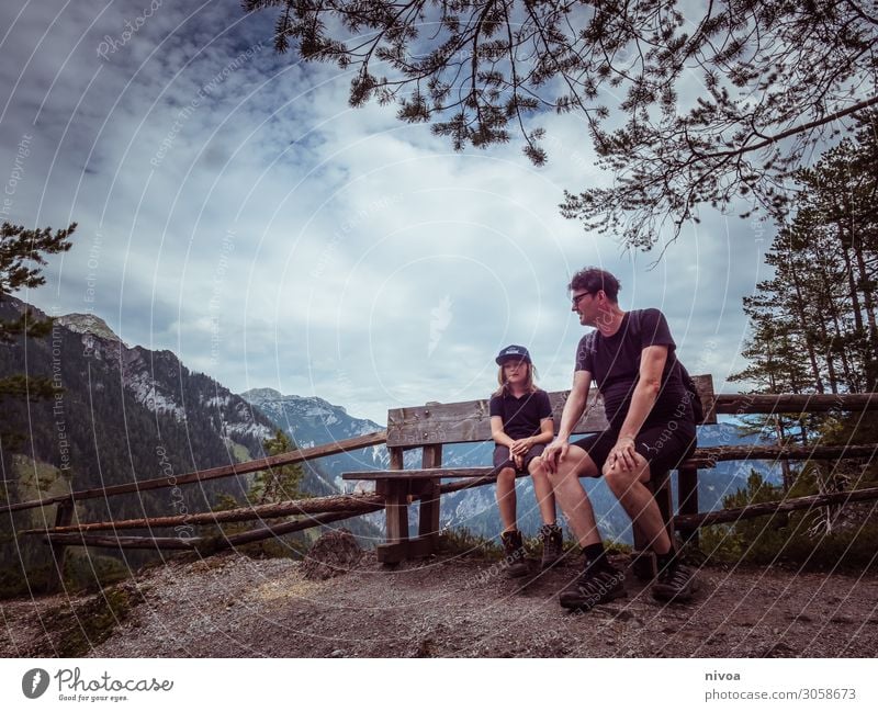 Father and son sitting on a bench in the mountains Harmonious Contentment Vacation & Travel Trip Far-off places Freedom Summer Summer vacation Mountain Hiking