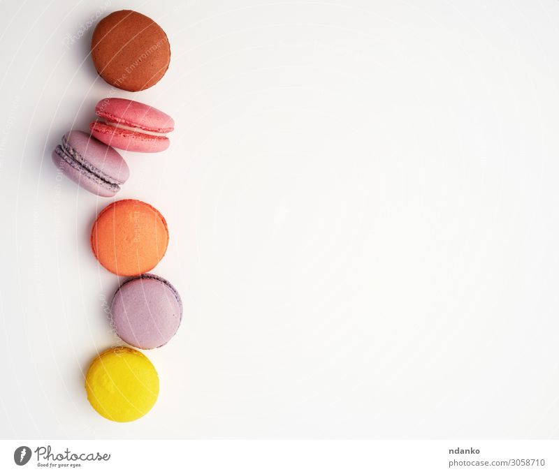 stack of colorful baked macaron almond flour Fruit Dessert Eating Fresh Delicious Above Brown Yellow Pink White Colour Tradition Almond assorted assortment