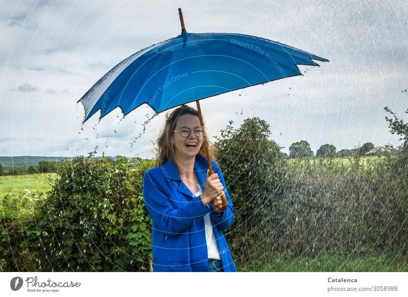 With umbrella, charm... | and fun in the rain, laughing woman with blue umbrella Young woman Youth (Young adults) 1 Human being Landscape Plant Drops of water