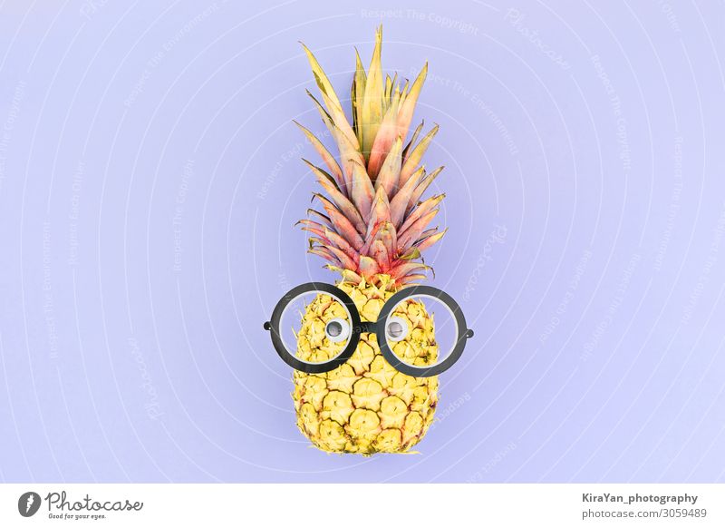 Funny yellow pineapple face with glasses on violet background. happy face sale smart kid children funny cartoon character fruit food isolated tropical fresh