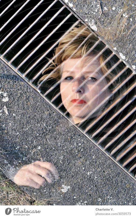 behind bars Feminine Woman Adults Face Hand 1 Human being 45 - 60 years Drainage Blonde Concrete Metal Observe Touch To fall To hold on Sadness Exceptional