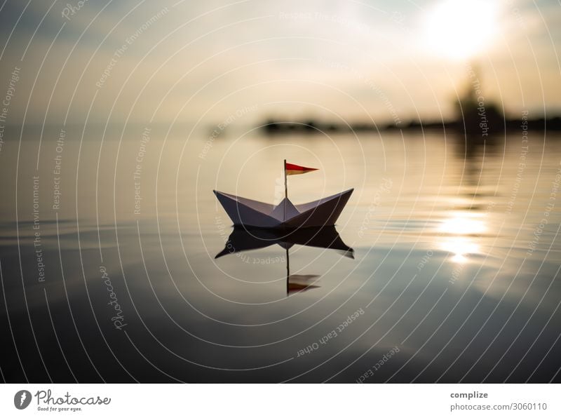 Smooth sailing . Paper boat on a lake voyage peaceful... tranquillity Wellness relaxation vacation Peaceful Lake Water Beach Harbour ship +sailboat Sailing
