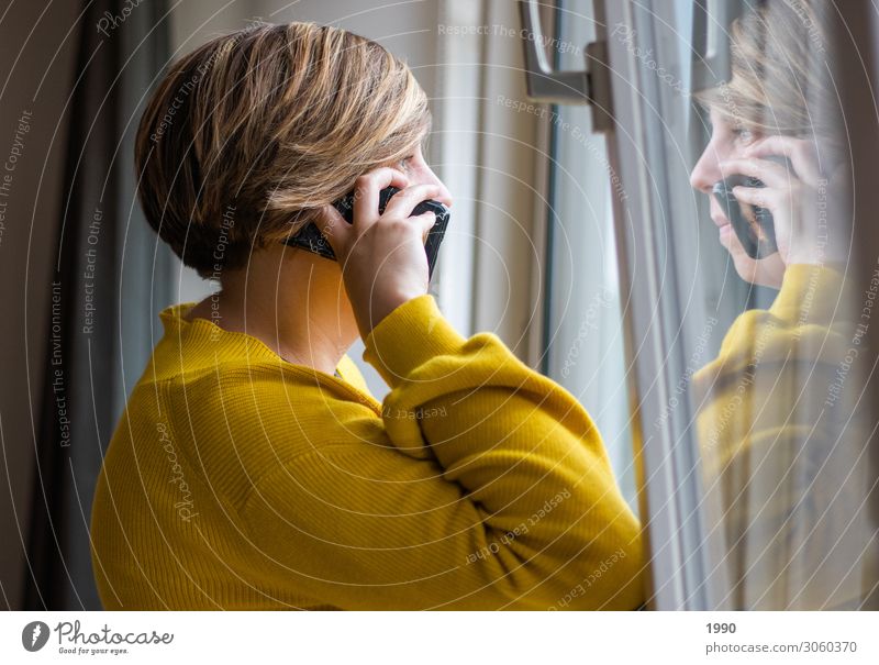 Girl on the phone looking out the window Lifestyle Cellphone Human being Feminine Young woman Youth (Young adults) 1 18 - 30 years Adults Sweater