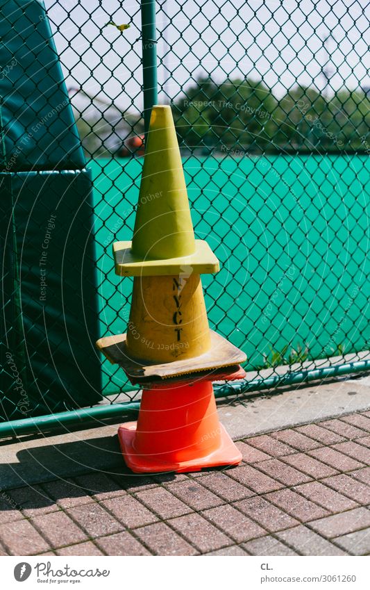 hat game Leisure and hobbies Playing Sporting Complex Sporting event Lanes & trails Traffic cone Fence Characters Road sign Yellow Orange Arrangement Safety