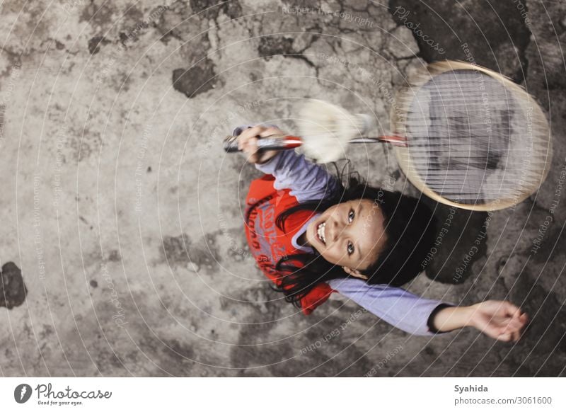 Girl Jumping Playing Badminton Human being Child 1 8 - 13 years Infancy Athletic Sports Colour photo Exterior shot Aerial photograph Copy Space right Evening