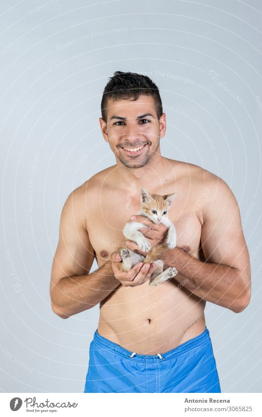 stduio shot of man and kitty smiling Lifestyle Summer Human being Man Adults Youth (Young adults) Animal Pet Cat Smiling Love Eroticism Small Strong Emotions