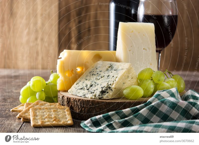 Assortment of cheeses and wine on wooden table Cheese Wine Food Healthy Eating Food photograph Beverage Alcoholic drinks assortment Wood Bottle French Gourmet
