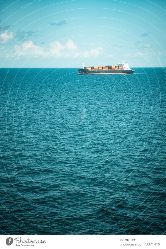 A container ship at sea Economy Trade Logistics Nature Sky Clouds Sun Climate change Beautiful weather Waves Coast North Sea Baltic Sea Ocean Transport