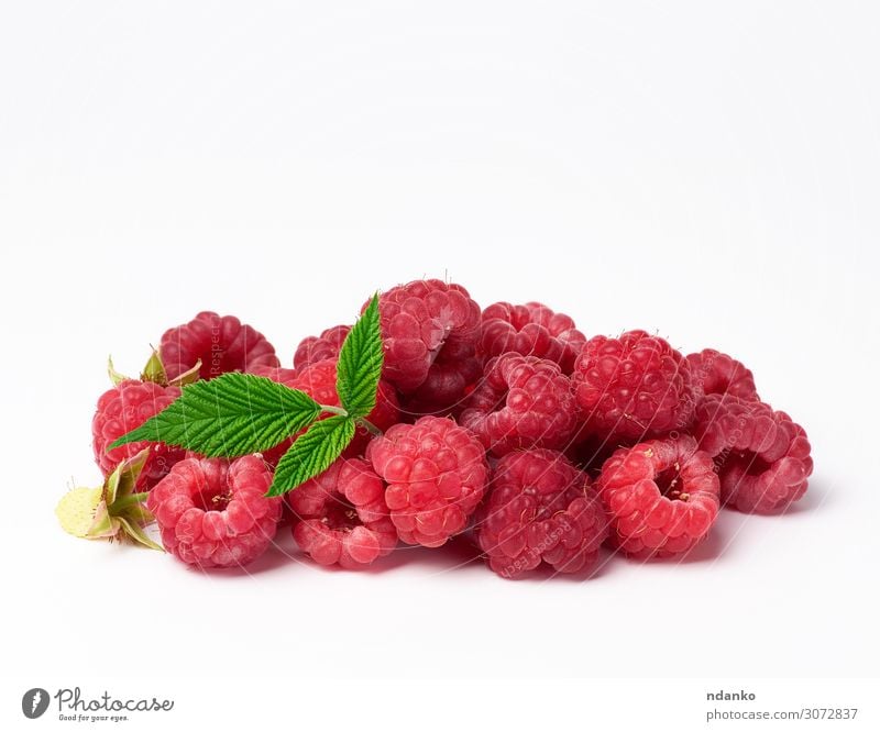 bunch of red ripe raspberries on a white background Fruit Dessert Nutrition Vegetarian diet Diet Juice Summer Group Nature Plant Leaf Eating Fresh Delicious