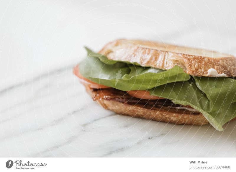 BLT Sandwich on Marble blt Bacon Lettuce Tomato Lunch Meat Food Healthy Eating Dish Food photograph Meal Bread Slice Sliced Green