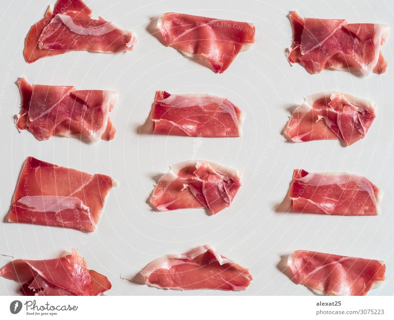 Serrano ham pattern on white background Meat Plate Thin Red White Colour Tradition appetizer Cooking cured Delicatessen fat food Gourmet Ham isolated jamon Pork