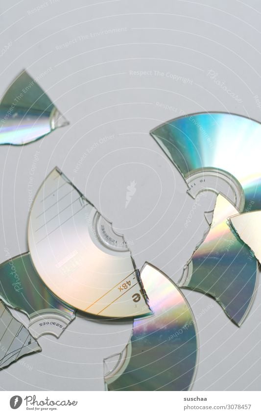 Retired? CD DVD-ROM Slice Broken Digital Data storage Shard Happy Round Reflection Prismatic colour Old Archaic Technology Music Video data collection Data bank