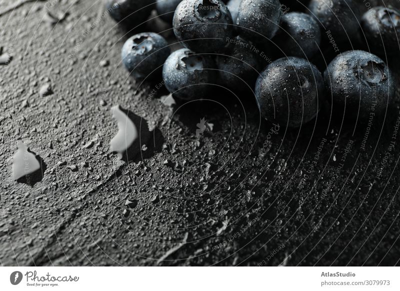 Blueberries on black cement background with drops,  space for text natural color nature abstract table summer delicious macro backdrop ripe fruits design