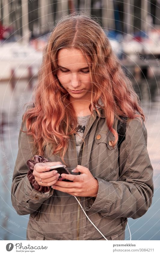 Young woman using mobile phone smartphone Lifestyle Vacation & Travel Summer Telephone Cellphone PDA Technology Internet Human being Youth (Young adults) Woman