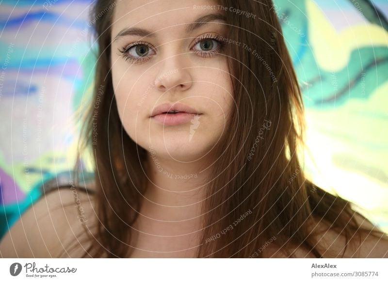 Portrait of a young woman in front of a colorful disc Lifestyle Style Beautiful Living or residing Room Young woman Youth (Young adults) Face 18 - 30 years