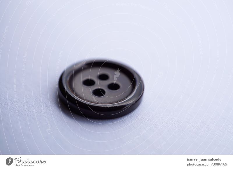 black button on the white background Buttons Black Plastic Isolated (Position) single object Still Life White Neutral Background Object photography Circle