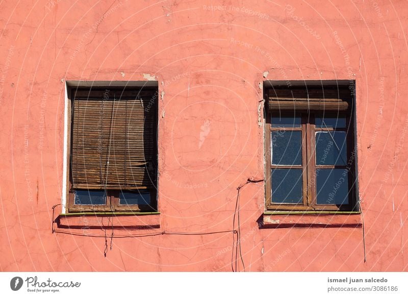 window on the red facade of the house in the city Window Red Facade Building Exterior Balcony House (Residential Structure) Home Street City Exterior shot