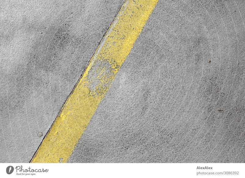 Yellow strip road marking on concrete Incomplete Old Concrete Ground concrete road Street Lane markings pores Crumbled Broken Diagonal Pattern