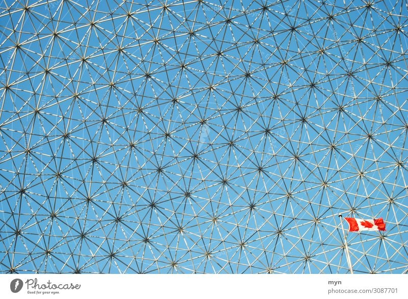 Biosphere building of the 1967 World's Fair in Montreal Canada with flag Net Pattern Grid Manmade structures Network Steel construction Interlaced