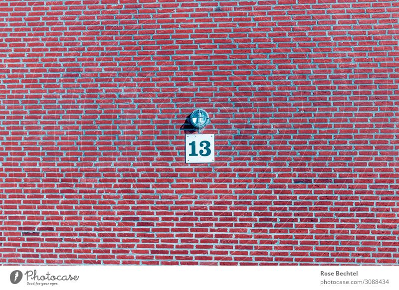 Thirteen with lamp Wall (barrier) Wall (building) Stone Digits and numbers Signs and labeling Creepy Red Popular belief 13 Sadness Lamp Brick Colour photo