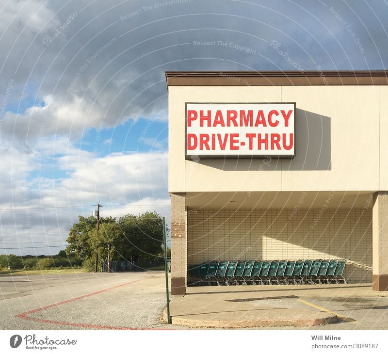 Pharmacy Storefront in a Small Town Storage Medication Drugstore Cart Shopping Trolley Food drive through Old Front view Front side Signage