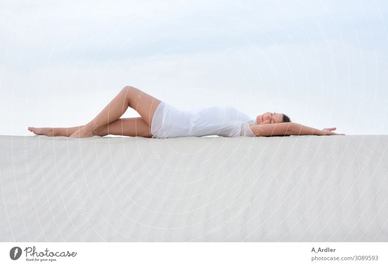 young woman lies on a sand dune Lifestyle Elegant Beautiful Wellness Harmonious Well-being Contentment Senses Relaxation Calm Meditation Cure Spa Summer