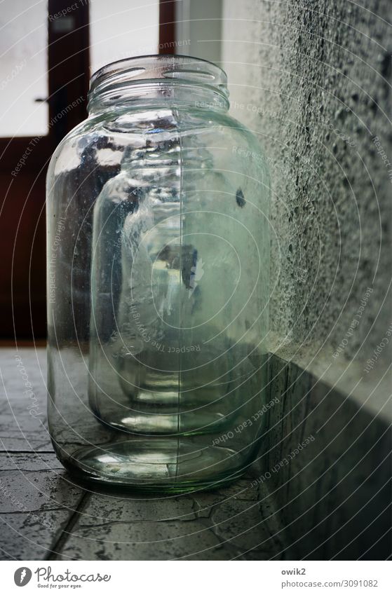 Glass matryoshka Preserving jar Wall (building) Floor covering Door Row Arrangement Stone Stand Transparent Behind one another Glittering Colour photo