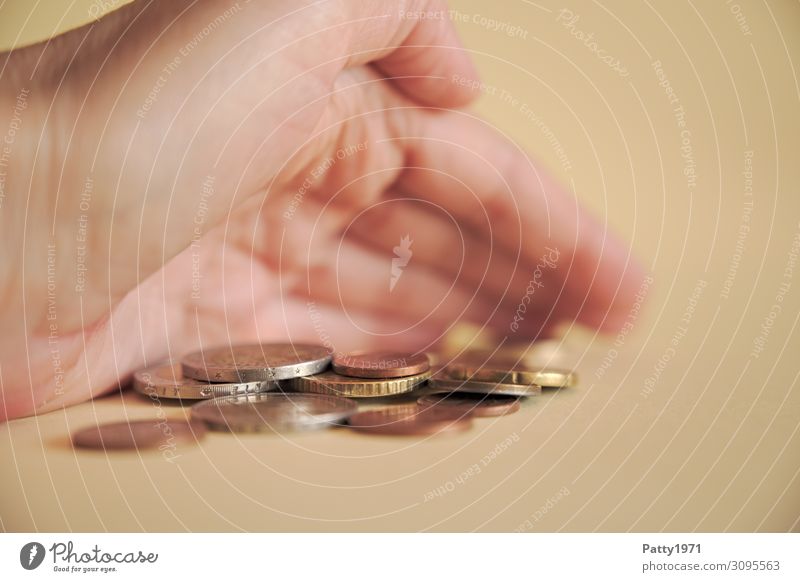 Close up of a hand pushing a few coins together Coin inflation Hand 1 Human being Thrifty Tight-fisted Avaricious Society Trade Sustainability Luxury Value