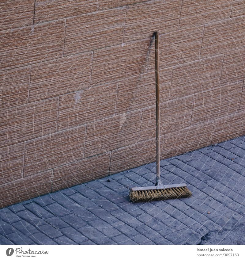wooden broom on the wall for cleaning the street Broom Wood Clean Tool Brush Object photography Sweep Equipment Story Dust handle Wall (building) Cleaner Old