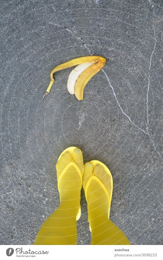 banana skin Banana Banana skin Throw away Dangerous Accident Testing & Control Slip Street Asphalt Pedestrian feet Legs Yellow Woman feminine Stockings