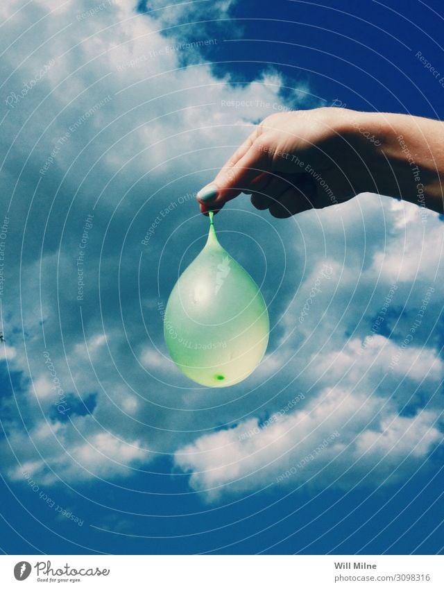 Hand Holding a Water Balloon waterballoon Summer Clouds Day Joy Action